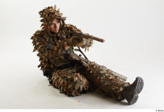 Frankie Perry in Ghillie Sitting aiming gun sitting whole body…